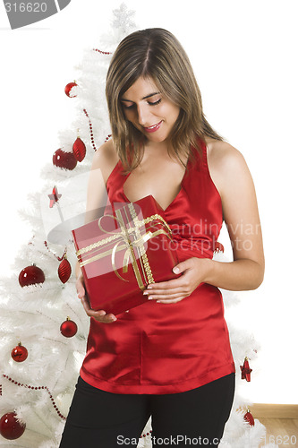 Image of Happy woman with Chirstmas gifts