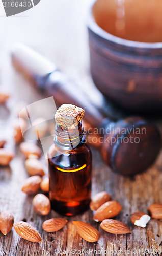Image of almond oil in a glass bottle