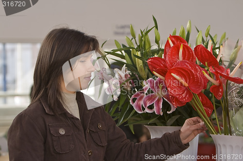 Image of Woman buying flowers