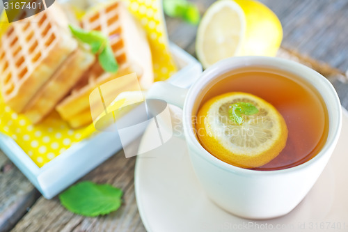 Image of tea with lemon and waffle