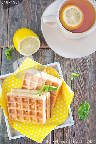 Image of tea with lemon and waffle