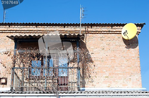 Image of balcony in the house and a satellite dish