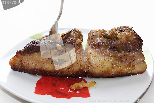 Image of baked piece of meat on the plate