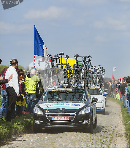 Image of The Car of Omega Pharma- Quick StepTeam on the Roads of Paris Ro