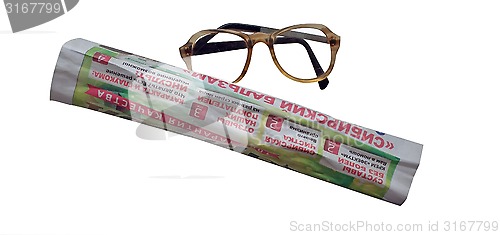 Image of newspaper and glasses