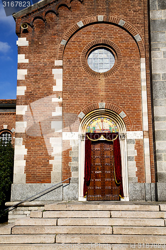 Image of  church  in  the samarate     brick tower sidewalk italy  lombar