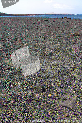 Image of white coast lanzarote  in     beach  stone water  and summer 