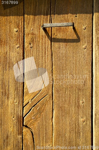 Image of the   cheglio rusty brass brown knocker 