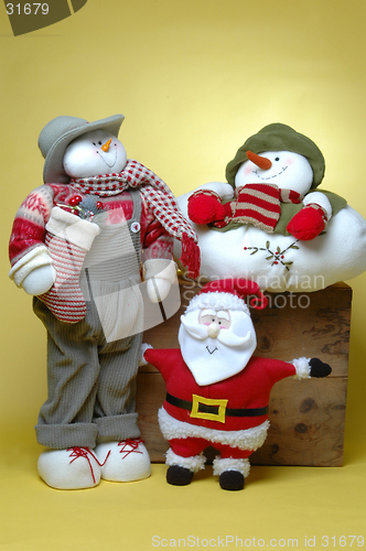 Image of man with gifts, snowman and santa claus