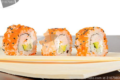 Image of Closeup of three California maki sushi in row