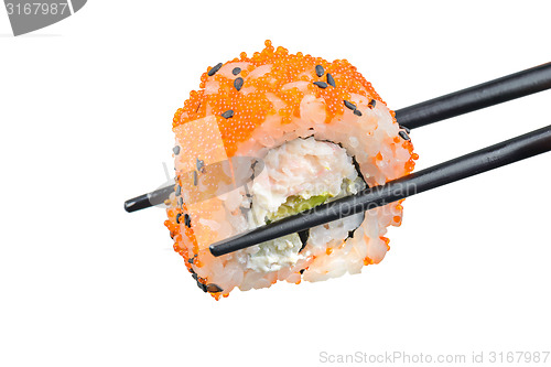 Image of Sushi roll with black chopsticks 