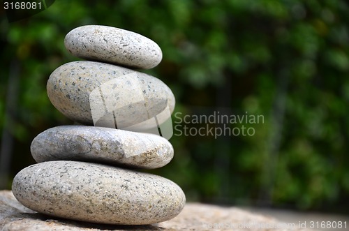 Image of Stack of zen rocks in garden