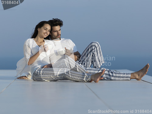 Image of relaxed young couple at home