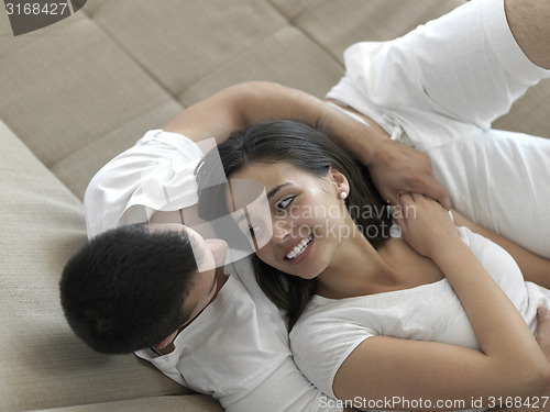 Image of relaxed young couple at home