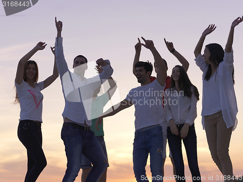 Image of party people  on sunset