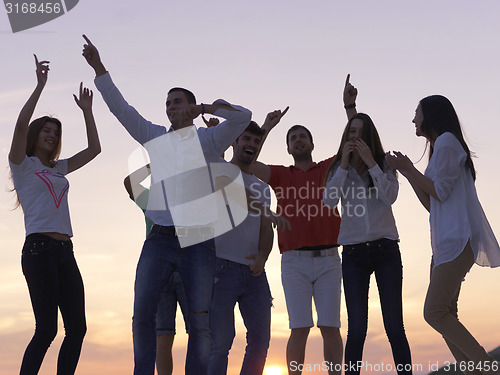 Image of party people  on sunset