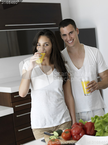 Image of happy young couple in kicthen