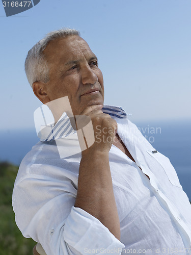 Image of senior man sitting outside
