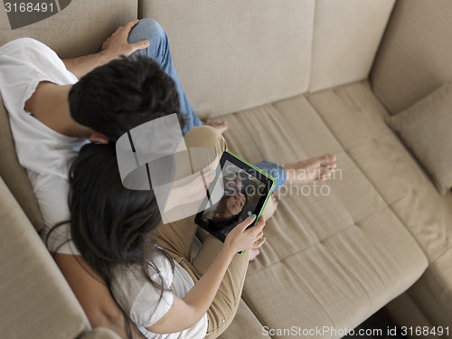 Image of young couple making selfie together at home