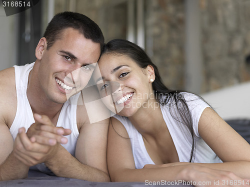 Image of couple relax and have fun in bed