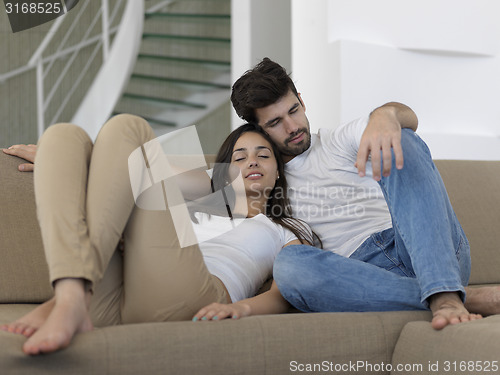 Image of young couple making selfie together at home