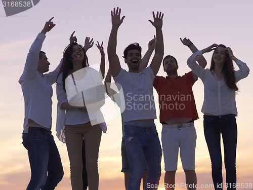 Image of party people  on sunset