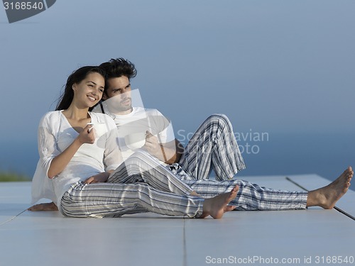 Image of relaxed young couple at home
