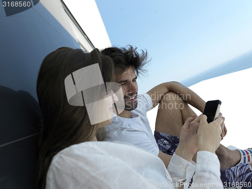 Image of young couple making selfie together at home