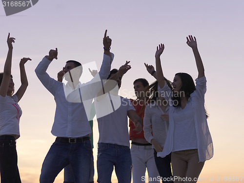 Image of party people  on sunset