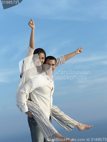 Image of happy young romantic couple have fun arelax  relax at home