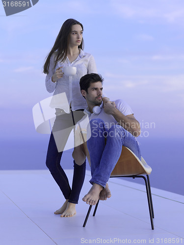Image of relaxed young couple at home
