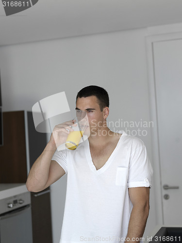 Image of man having orange juice