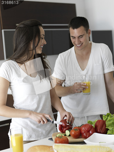 Image of happy young couple in kicthen