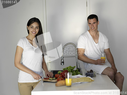 Image of happy young couple in kicthen