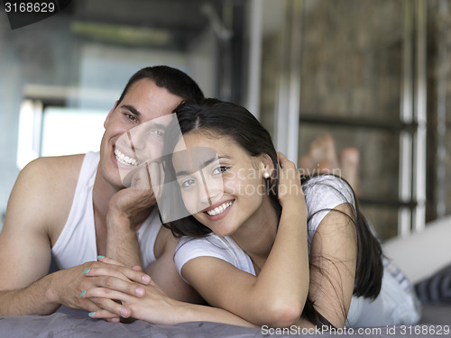 Image of couple relax and have fun in bed