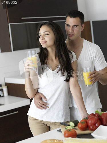 Image of happy young couple in kicthen