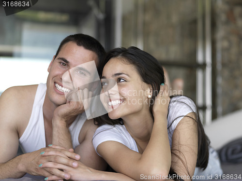 Image of couple relax and have fun in bed