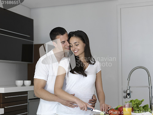 Image of happy young couple in kicthen