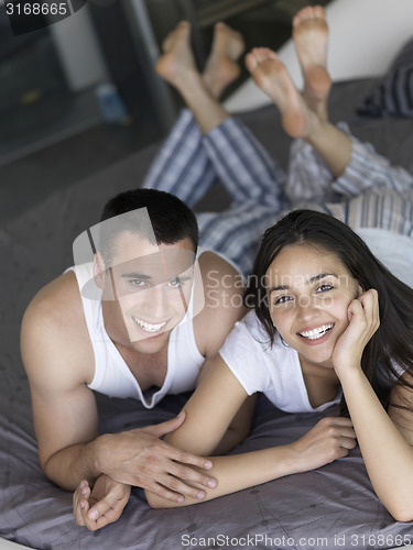 Image of couple relax and have fun in bed