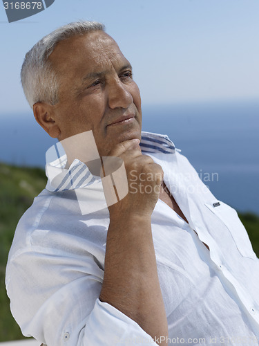 Image of senior man sitting outside