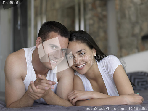 Image of couple relax and have fun in bed