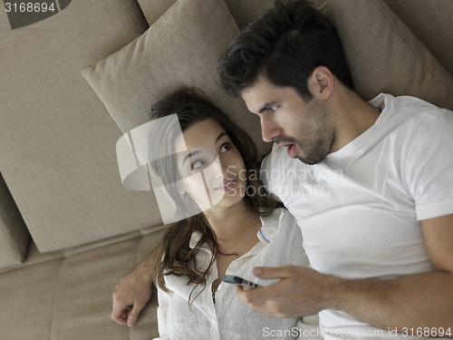 Image of young couple making selfie together at home