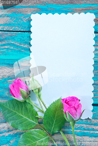 Image of flowers and sheet for note