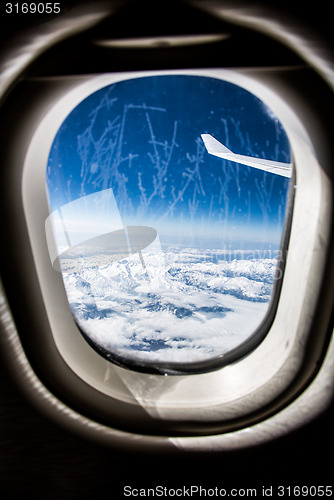 Image of Frost on the Airplane glass window.