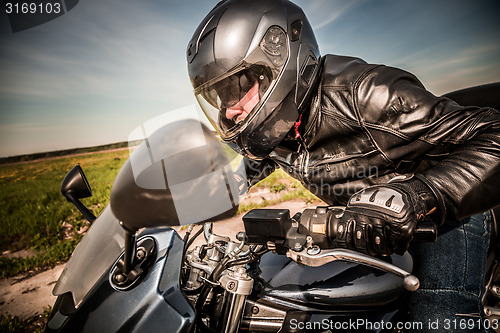 Image of Biker racing on the road