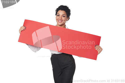 Image of Happy businesswoman holding banner