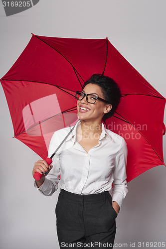 Image of Happy woman with umbrella