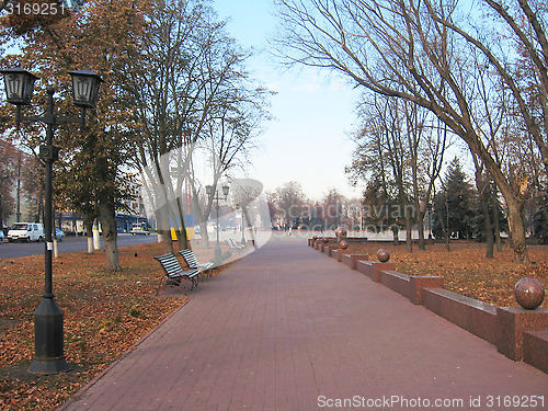 Image of benches and path in the Autumn city park