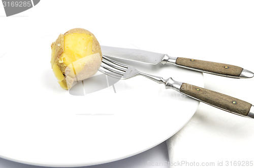 Image of Potato peeling on table