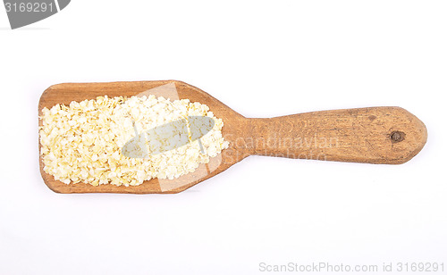 Image of Millet flakes on shovel